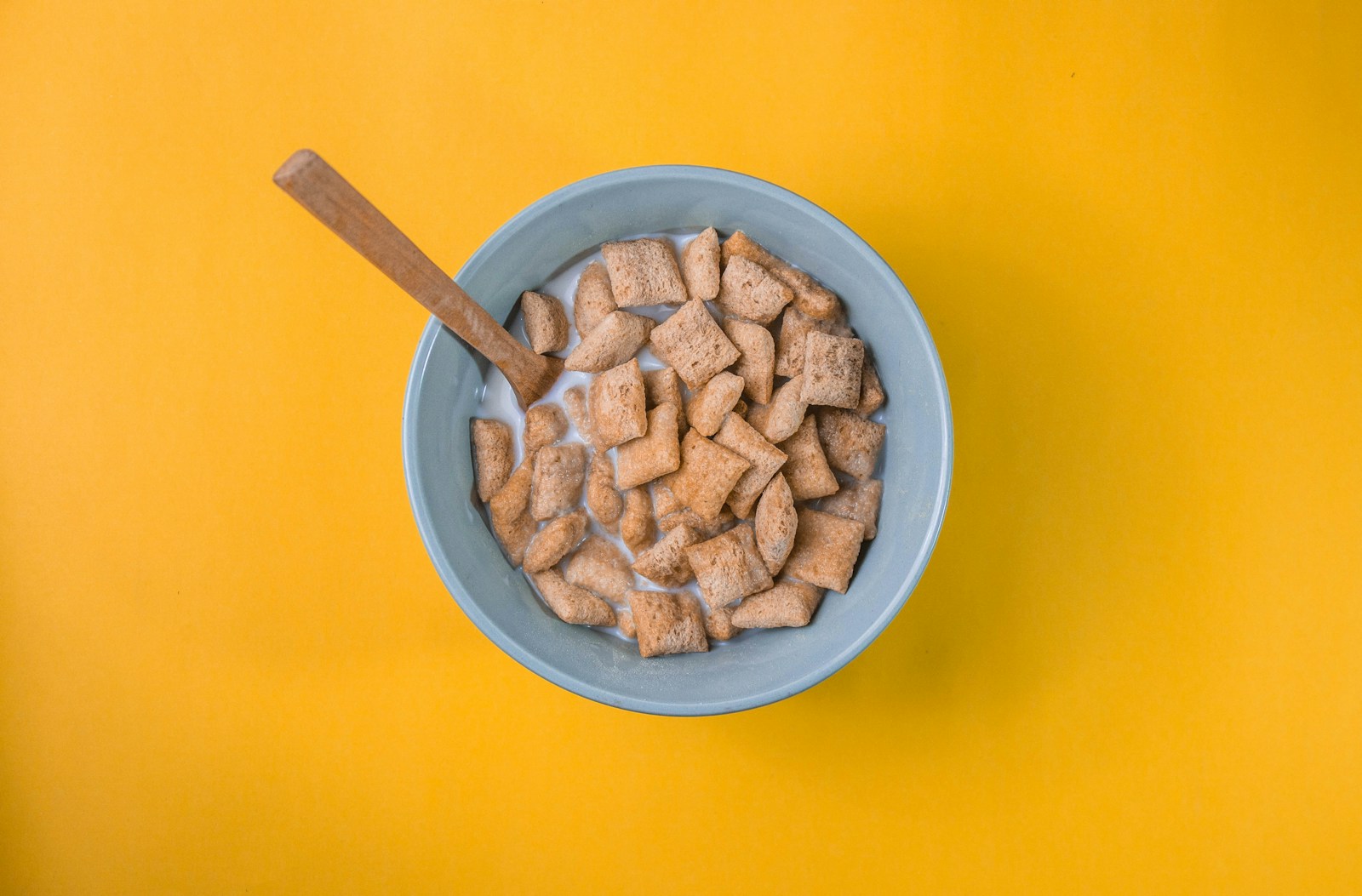 brown peanuts in blue ceramic bowl